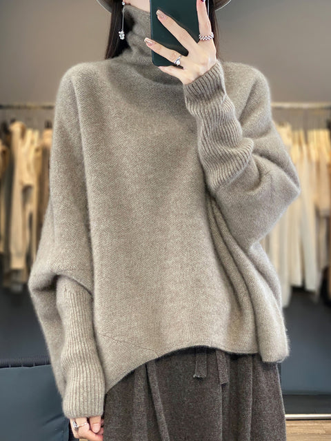 Maglione invernale in lana dolcevita con maniche a pipistrello da donna