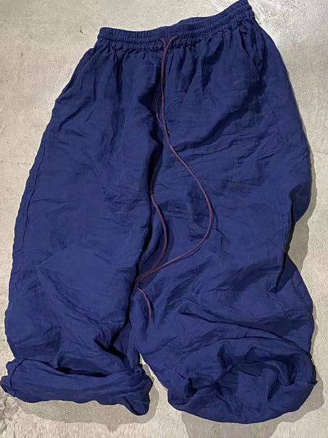 Pantaloni vintage autunnali larghi in ramiè con risvolto da donna