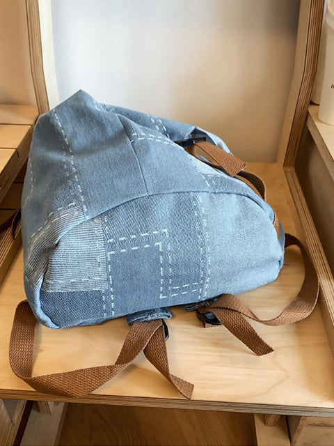 Zaino in denim impiombato con toppa casual